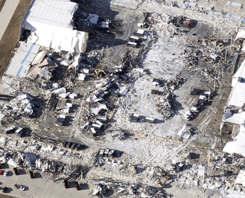 West view of tornado damage of Amazon warehouse