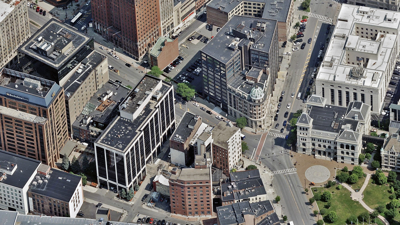 Oblique aerial image of buildings around a road in Albany, NY, published by Vexcel.