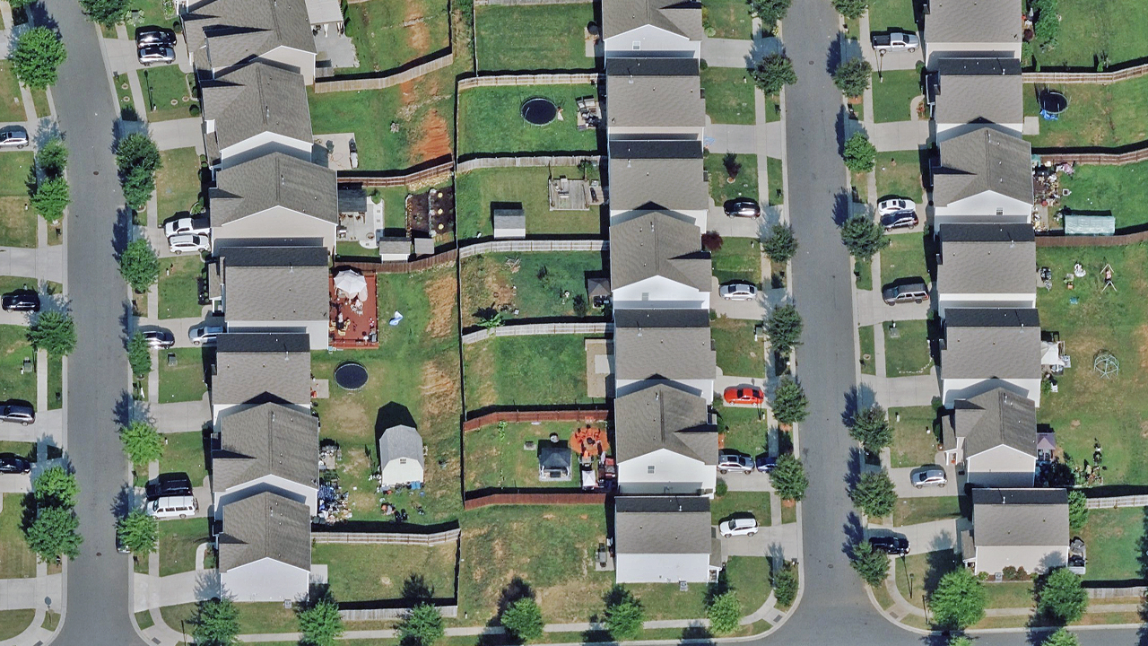 Oblique aerial image of a neighborhood in Dallas, NC, published by Vexcel.