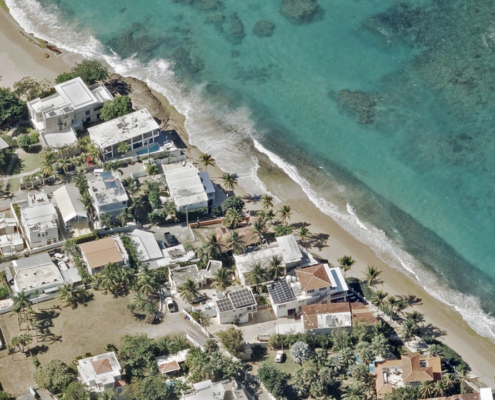 Oblique aerial image of beachfront properties in Isabela, Puerto Rico, published by Vexcel.